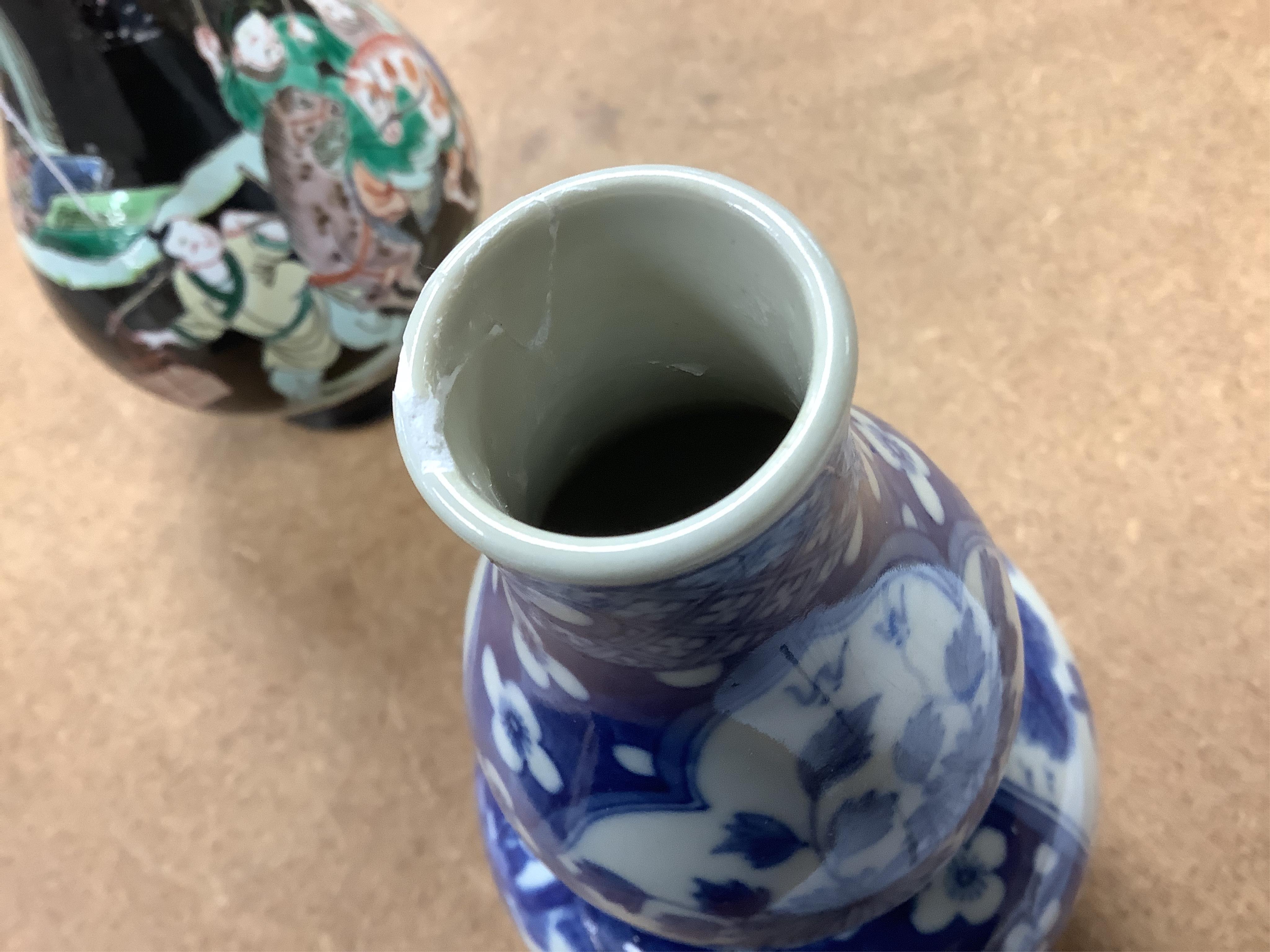 Two Chinese vases; a blue and white double gourd vase and famille noir vase, famille noir 19cm high. Condition - good